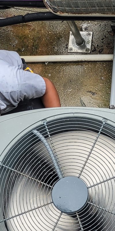 HVAC technician millennial is Latino working to maintain high efficiency heating and cool at beach. HVAC technician millennial is Latino working to maintain high efficiency heating and cool at beach.